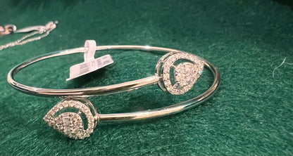 Cuff style diamond and gold bangle bracelet
